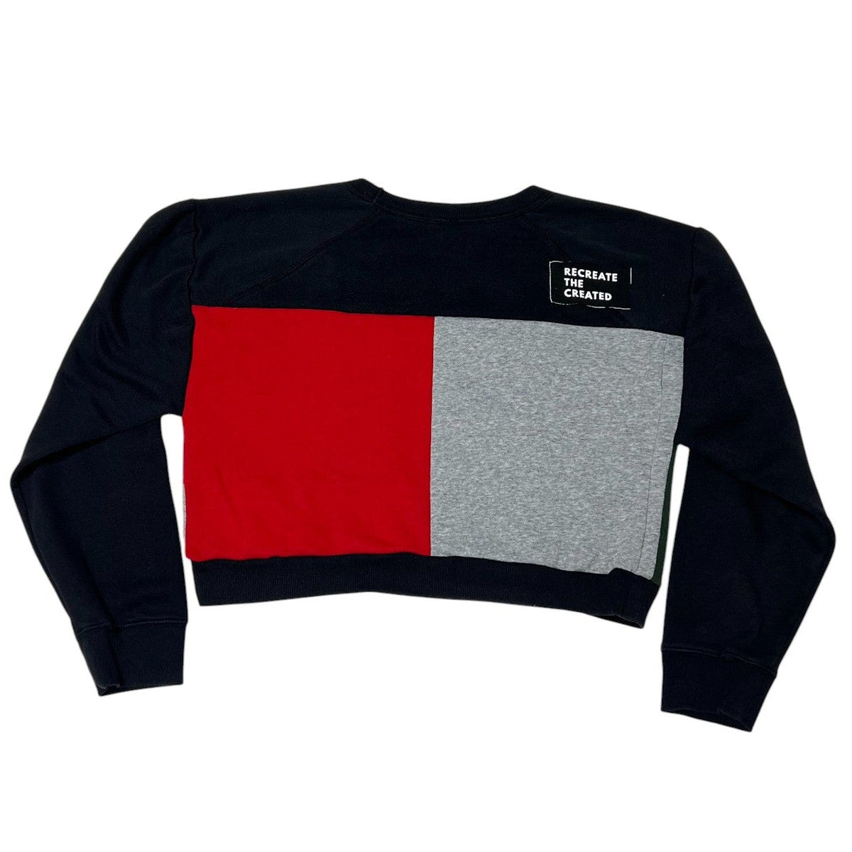 Black sweater with red and gray square design on a white background