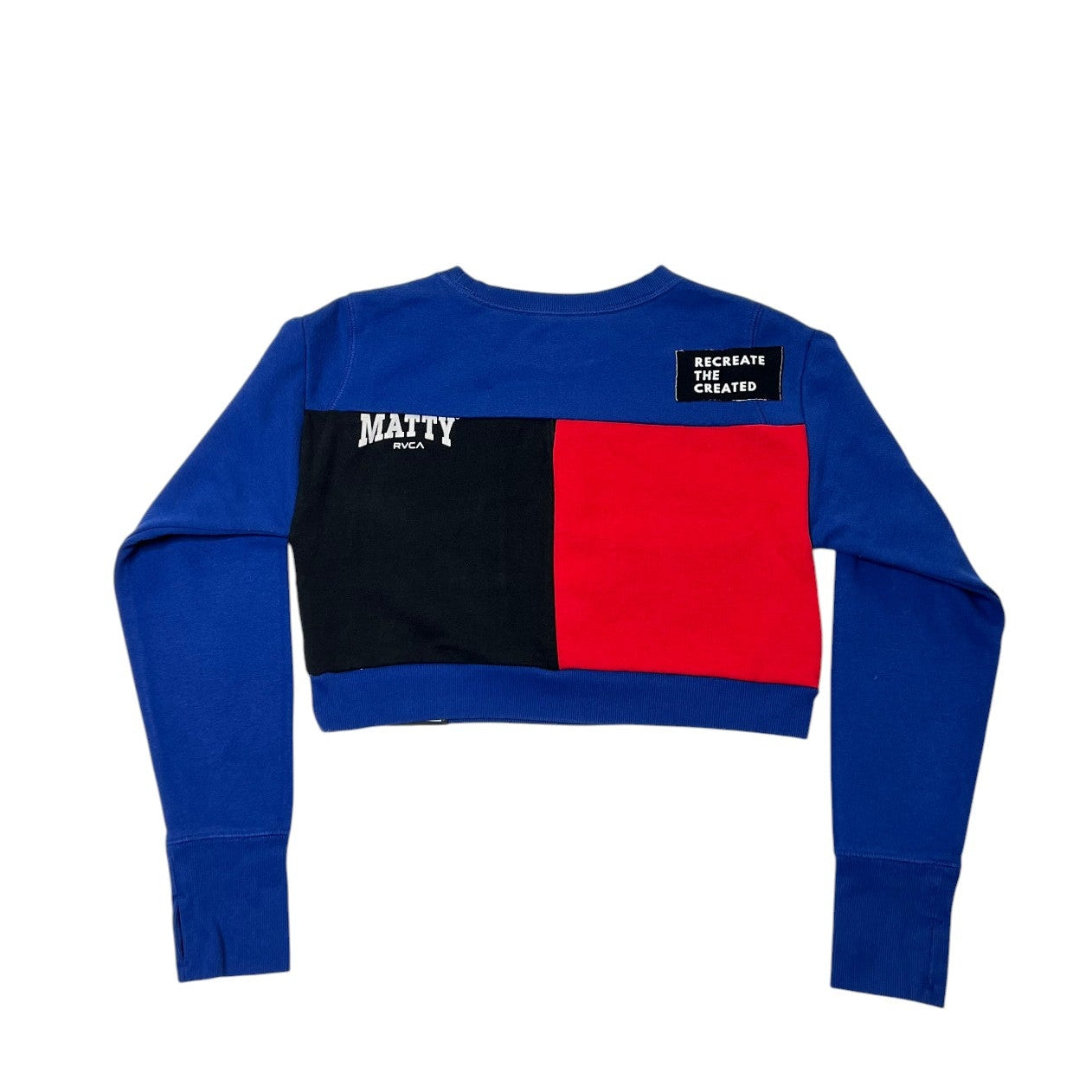 Color-blocked sweater with blue, red, and black sections on a white background